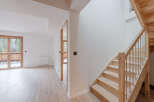 This stunning property boasts a bright and airy interior with a modern staircase.