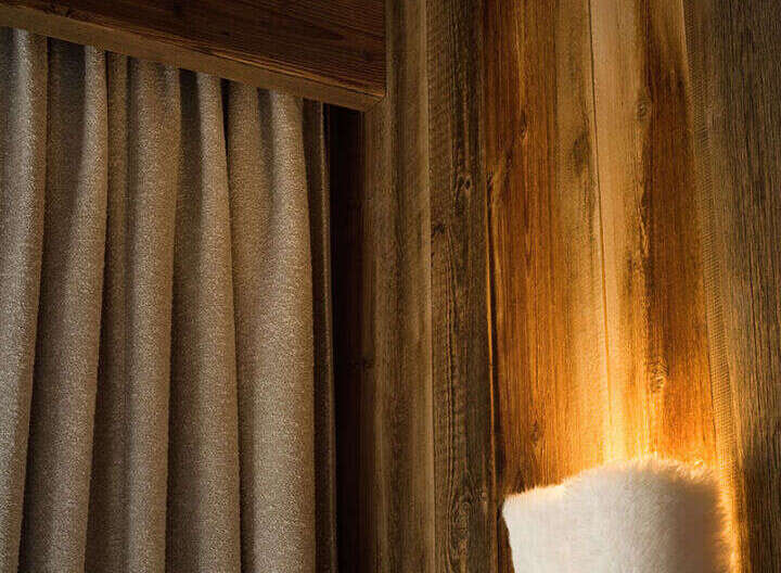 This cozy space features beautiful wooden walls and ceiling, creating a warm and inviting atmosphere.