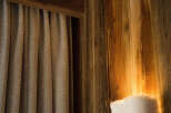 This cozy space features beautiful wooden walls and ceiling, creating a warm and inviting atmosphere.