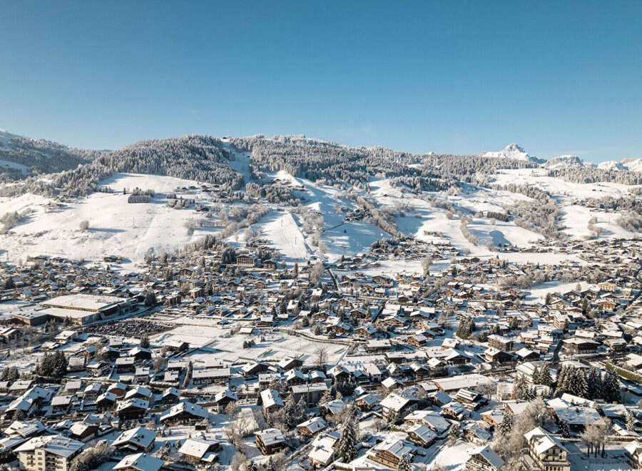 Nestled in a picturesque winter wonderland, this property offers stunning views of snow-capped mountains and a charming village.