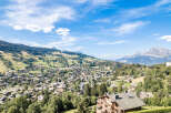 Experience breathtaking mountain views from this charming village home nestled in a lush green valley.
