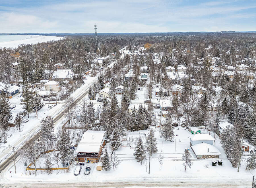 This stunning property offers a serene winter wonderland setting, perfect for those seeking a peaceful retreat.