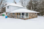 This charming stone-clad home offers a unique blend of rustic charm and modern comfort.