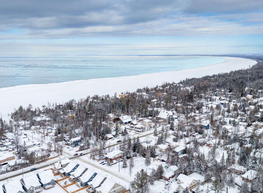 Discover the charm of lakeside living in this stunning aerial view.