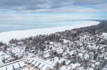 Discover the charm of lakeside living in this stunning aerial view.