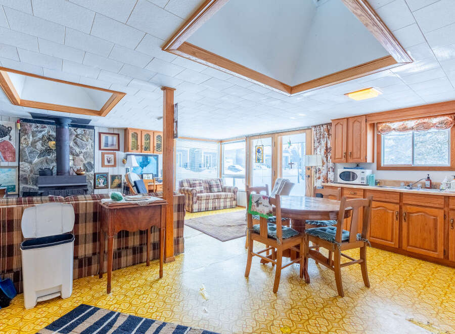 This cozy home features a unique layout with a wood-burning fireplace, perfect for chilly evenings.