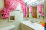 Step into this charming bathroom, featuring a unique vintage aesthetic.