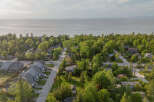 Discover this charming residential neighborhood nestled amongst lush greenery, offering a serene escape with proximity to the water.