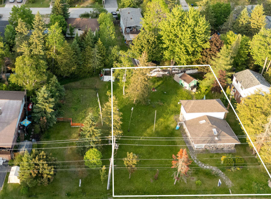 Discover this expansive property offering ample space for outdoor enjoyment and potential expansion.