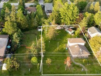 Discover this expansive property offering ample space for outdoor enjoyment and potential expansion.