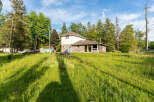 Discover this charming property featuring a unique stone-accented home nestled amidst lush greenery and mature trees.