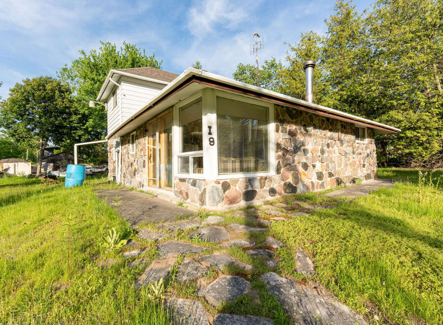 Discover this charming property featuring a unique stone exterior and a welcoming interior.