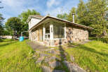 Discover this charming property featuring a unique stone exterior and a welcoming interior.