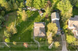 Discover this charming property featuring a well-maintained lawn and mature trees, perfect for outdoor enjoyment.