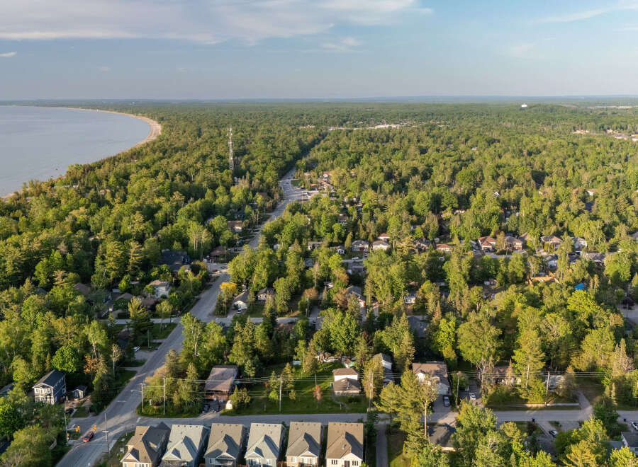 Discover this charming waterfront community nestled amidst lush greenery, offering a serene escape with direct access to the beach.