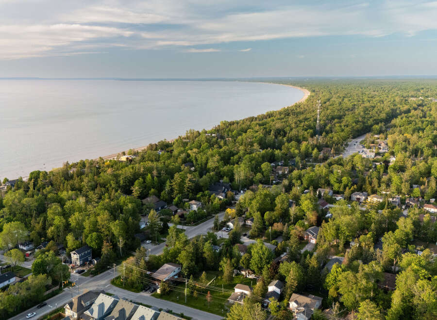 Discover this charming coastal community nestled amongst lush greenery, offering a serene escape with stunning water views.