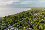 Discover this charming coastal community nestled amongst lush greenery, offering a serene escape with stunning water views.