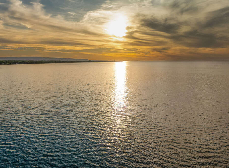 Experience breathtaking sunsets over the water from this prime real estate location.