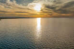 Experience breathtaking sunsets over the water from this prime real estate location.