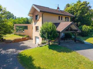 This stunning property boasts a modern design with a touch of rustic charm, perfect for those seeking a tranquil retreat.
