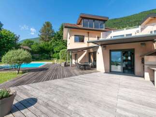 This stunning property boasts a luxurious outdoor space, perfect for entertaining or relaxing.