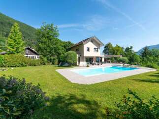 Discover your dream home with this stunning property! Featuring a beautiful swimming pool, a spacious lawn, and a modern design, this house offers the perfect blend of luxury and comfort.