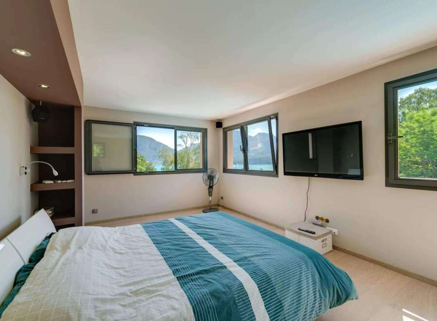 Experience the tranquility of this stunning bedroom with breathtaking views.