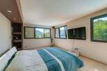 Experience the tranquility of this stunning bedroom with breathtaking views.