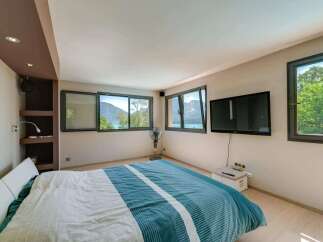 Experience the tranquility of this stunning bedroom with breathtaking views.