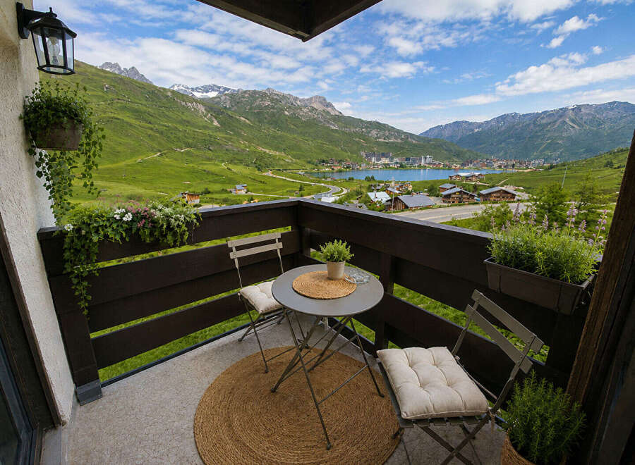 Enjoy breathtaking mountain and lake views from this charming balcony, perfect for your morning coffee or evening relaxation.