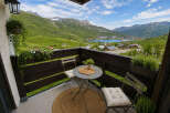 Enjoy breathtaking mountain and lake views from this charming balcony, perfect for your morning coffee or evening relaxation.