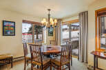 This stunning dining area features a rustic wooden table and chairs, perfect for enjoying meals with family and friends.