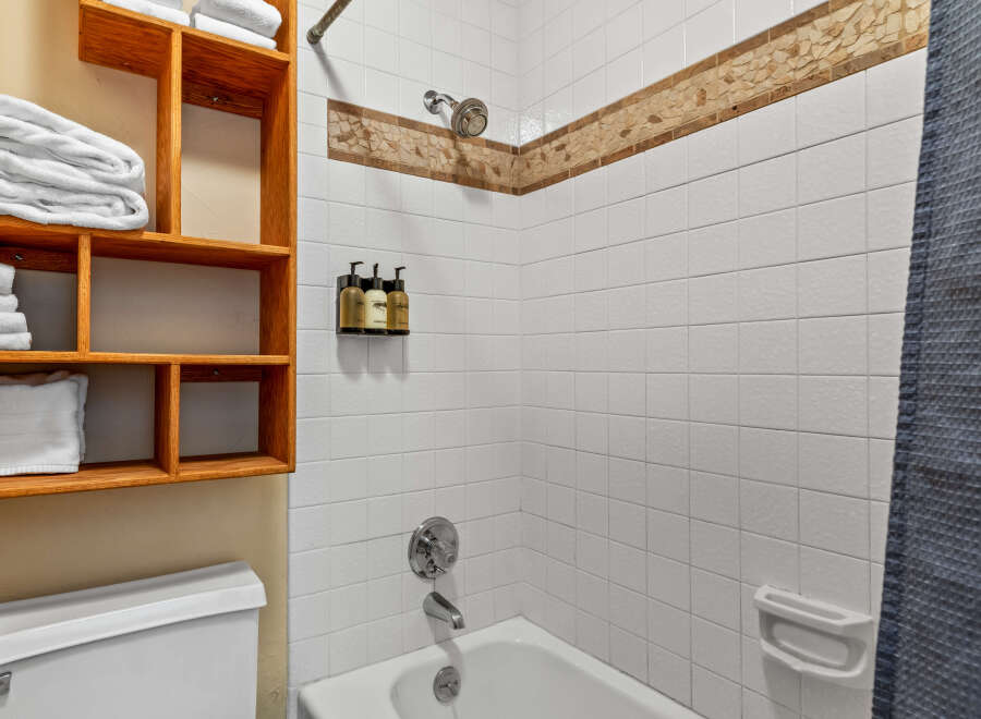 Step into a clean and inviting bathroom space.