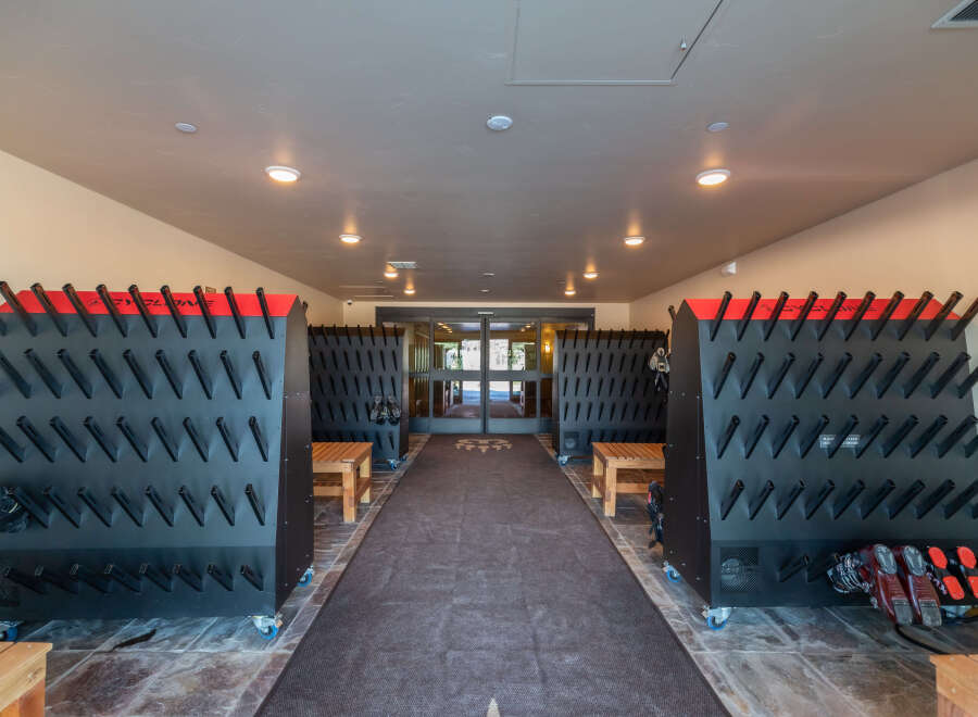 Step into the ultimate ski and snowboard storage and drying area, a key feature of this property.