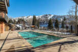 Enjoy the ultimate luxury with this stunning property featuring a heated outdoor pool, perfect for year-round enjoyment.