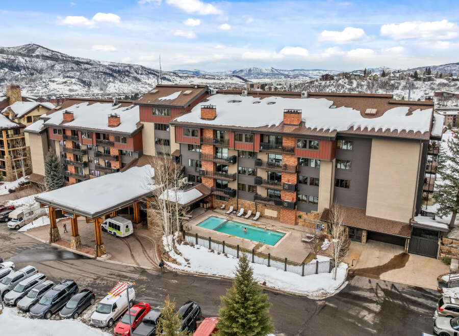 Discover luxury living at this stunning property, featuring a beautiful outdoor pool and breathtaking mountain views.