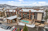 Discover luxury living at this stunning property, featuring a beautiful outdoor pool and breathtaking mountain views.