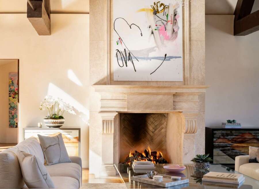 Experience luxury living in this stunning property featuring a cozy fireplace, perfect for creating a warm and inviting atmosphere.