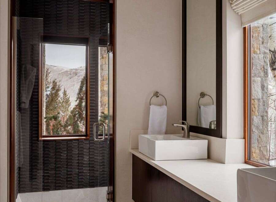 This luxurious bathroom boasts a modern design with high-end finishes.