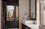 This luxurious bathroom boasts a modern design with high-end finishes.