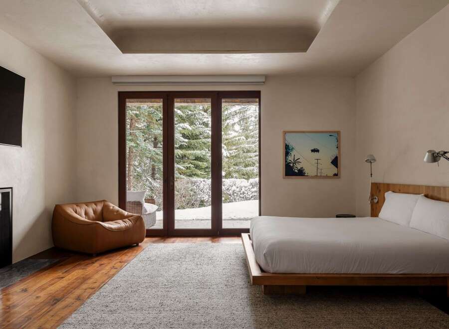 This stunning bedroom offers a serene retreat with its modern design and natural light.