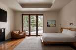 This stunning bedroom offers a serene retreat with its modern design and natural light.