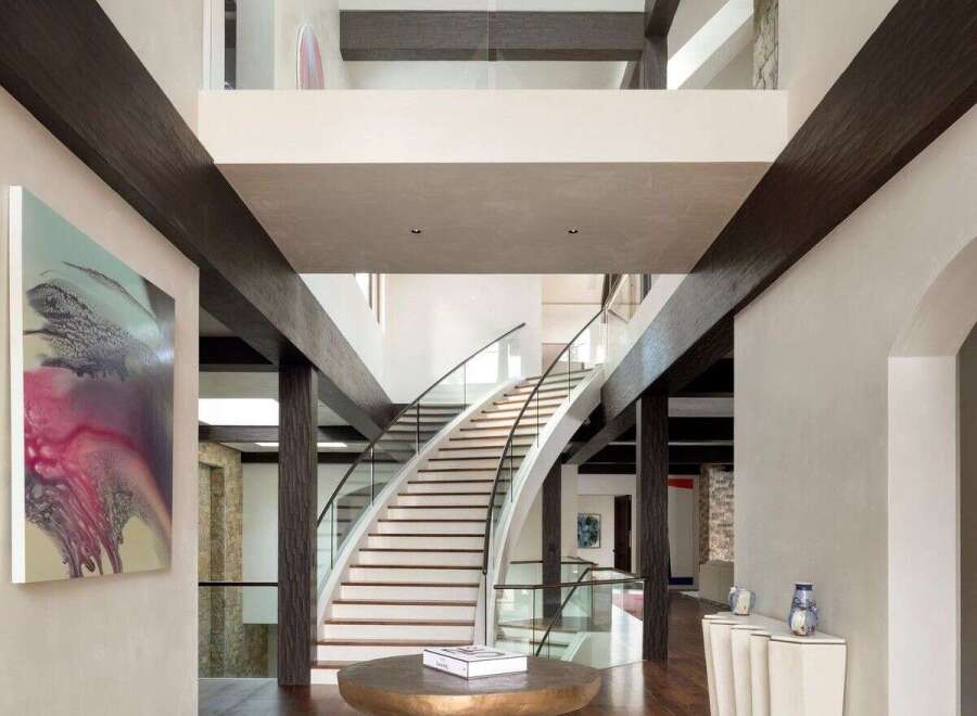 Step into luxury with this stunning property featuring a grand entrance and a sweeping staircase.