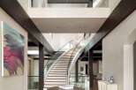 Step into luxury with this stunning property featuring a grand entrance and a sweeping staircase.