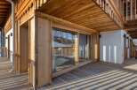 Experience the charm of this stunning wooden balcony, perfect for enjoying the outdoors.