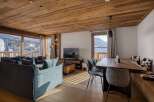Experience luxury living in this stunning property featuring a cozy living room with a modern design.