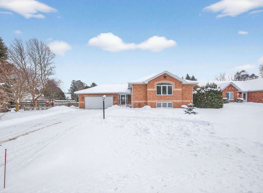 This charming brick home offers a warm and inviting atmosphere, perfect for those seeking comfort and style.