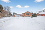 This charming brick home offers a warm and inviting atmosphere, perfect for those seeking comfort and style.