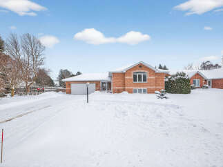 This charming brick home offers a warm and inviting atmosphere, perfect for those seeking comfort and style.