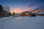 This stunning brick home offers a warm and inviting atmosphere, perfect for cozy winter evenings.